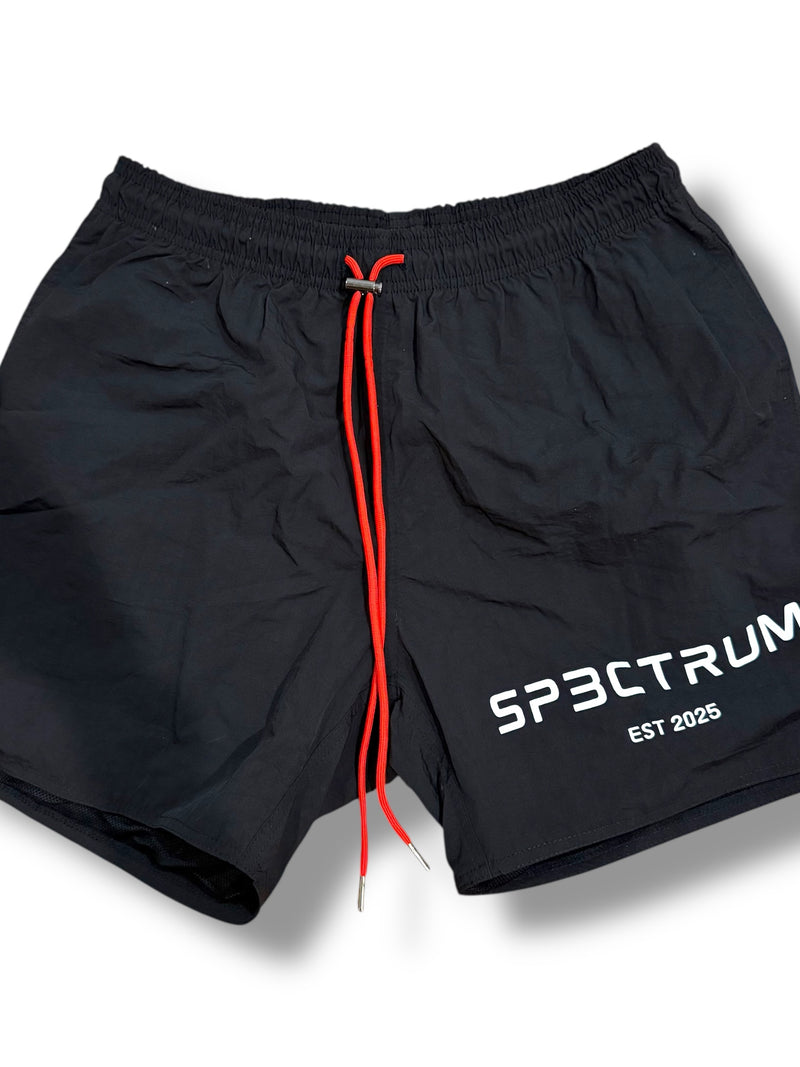 SP3CTRUM Archive Shorts in black — lightweight nylon active shorts, 5-inch inseam, elastic drawstring waistband, women's athletic wear, limited archive collection